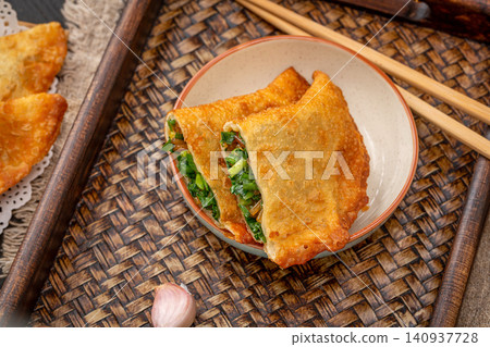 traditional Chinese Deep Fried Vegetable Dumplings, Crispy Golden Cai Jiao Pastry with Herb Filling traditional Chinese Deep Fried Vegetable Dumplings, Crispy Golden Cai Jiao Pastry with Herb Filling 140937728