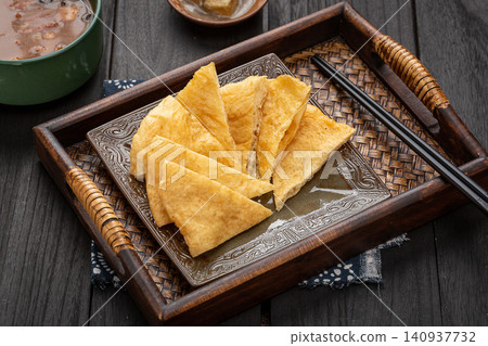 traditional Chinese Breakfast Fried Dough Blanket Youbing, Golden Crispy Flatbread Cruller traditional Chinese Breakfast Fried Dough Blanket Youbing, Golden Crispy Flatbread Cruller 140937732