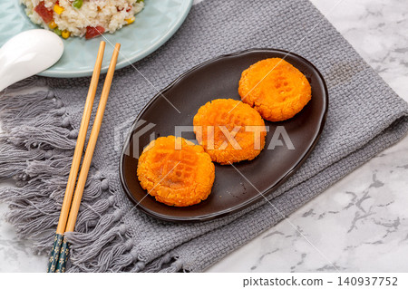 crispy deep fried pumpkin cakes traditional sweet Chinese dim sum dessert 140937752