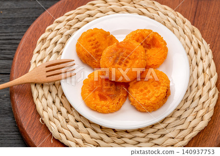 crispy deep fried pumpkin cakes traditional sweet Chinese dim sum dessert 140937753