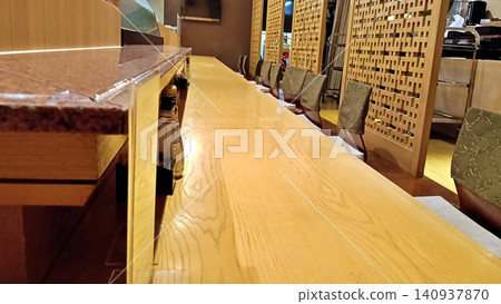 Wooden counter seats in a Japanese restaurant Wooden counter seats in a Japanese restaurant 140937870