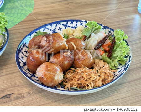 Thai Isan Sausage Served With Fresh Vegetables On Dining Table Thai Isan Sausage Served With Fresh Vegetables On Dining Table 140938112