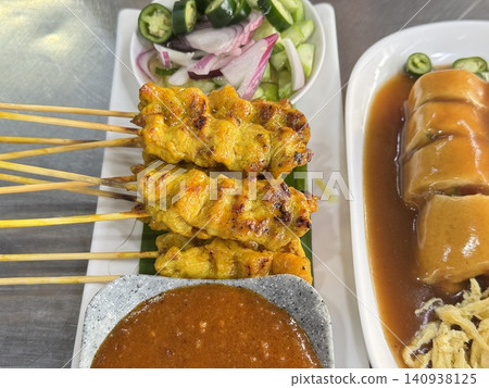 Traditional Thai Pork Satay Skewers With Peanut Dipping Sauce 140938125