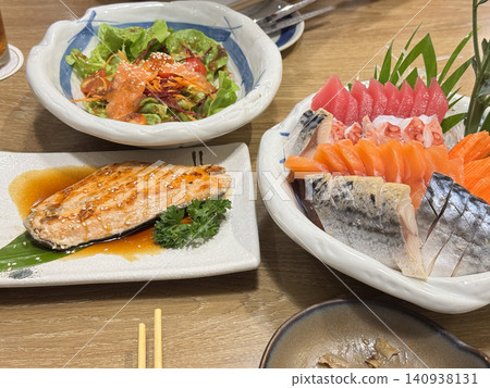 Abundant Japanese Seafood Dining Table Setup With Mixed Platters. Abundant Japanese Seafood Dining Table Setup With Mixed Platters. 140938131