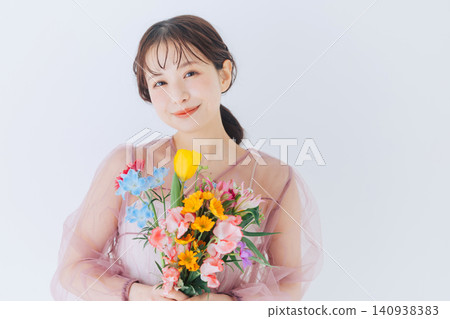 Young woman with a bouquet Young woman with a bouquet 140938383
