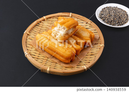 milk Flavored Fried Dough Stick Stuffed with Sweet Glutinous Rice Cake Ciba Mochi milk Flavored Fried Dough Stick Stuffed with Sweet Glutinous Rice Cake Ciba Mochi 140938559
