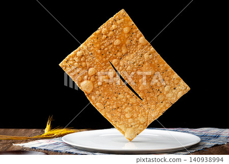 deep Fried Crispy Sesame Crackers, Traditional Chinese Golden Flaky Ribbon Pastry deep Fried Crispy Sesame Crackers, Traditional Chinese Golden Flaky Ribbon Pastry 140938994