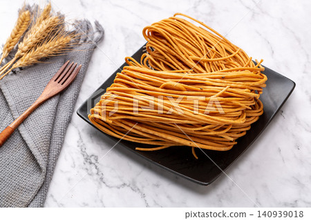 traditional Chinese Deep Fried Sanzi, Crispy Golden Thread Fried Dough Twist Pastry traditional Chinese Deep Fried Sanzi, Crispy Golden Thread Fried Dough Twist Pastry 140939018