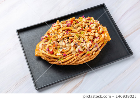 sweet Mongolian Sanzi Pastry Topped with Honey, Roasted Nuts and Dried Fruits sweet Mongolian Sanzi Pastry Topped with Honey, Roasted Nuts and Dried Fruits 140939025