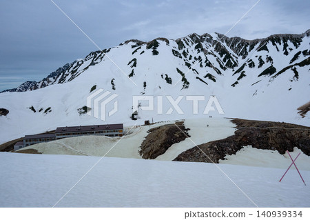 Snow-capped peaks floating in a sea of clouds 140939334