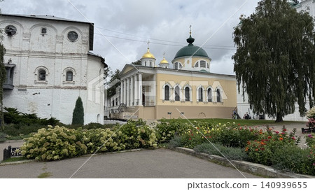Orthodox monastery with garden and historical architecture under cloudy sky Orthodox monastery with garden and historical architecture under cloudy sky 140939655