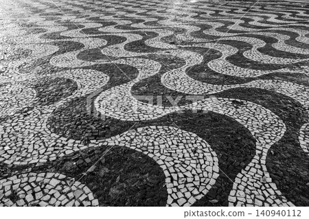 Mosaic portuguese pavement, black and white, wavelike. Pedestrian mall in downtown Manaus Mosaic portuguese pavement, black and white, wavelike. Pedestrian mall in downtown Manaus 140940112
