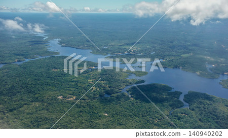 Aerial view over wide Negro river cutting through Amazon rainforest. Amazonas, Brazil Aerial view over wide Negro river cutting through Amazon rainforest. Amazonas, Brazil 140940202