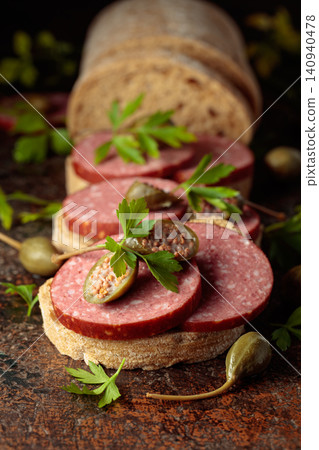 Sandwiches with smoked sausage on a vintage background. Sandwiches with smoked sausage on a vintage background. 140940478