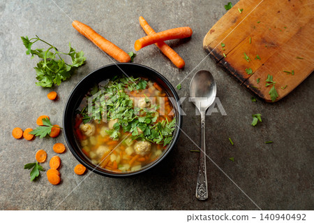 Classic meatball soup with potatoes, carrot and greens. Classic meatball soup with potatoes, carrot and greens. 140940492