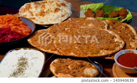 Full Turkish Family Feast Table with Traditional Food, Grilled Meat, Meze and Rustic Bread Full Turkish Family Feast Table with Traditional Food, Grilled Meat, Meze and Rustic Bread 140940639
