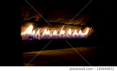 Turkish traditional oven. Fire in the wooden oven. Firewood is burning in the oven, preparation for baking bread. Turkish traditional oven. Fire in the wooden oven. Firewood is burning in the oven, preparation for baking bread. 140940652