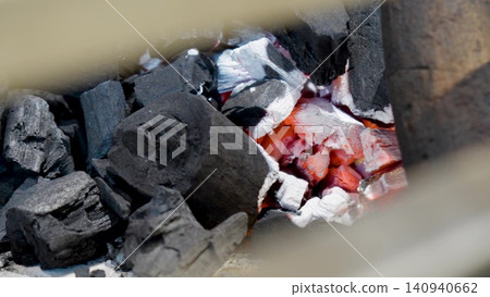 Red glowing fire hot charcoal video. Charcoal sparks. Firewood Free space for text. Red glowing fire hot charcoal video. Charcoal sparks. Firewood Free space for text. 140940662
