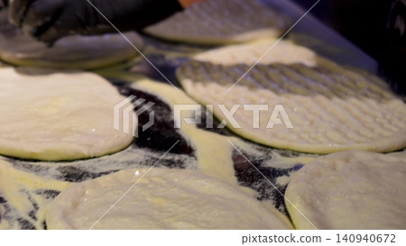 Video of a making a dough for turkish bread. The flying flour. Traditional turkish baking concept. Turkish bread. Homemade bread. Video of a making a dough for turkish bread. The flying flour. Traditional turkish baking concept. Turkish bread. Homemade bread. 140940672