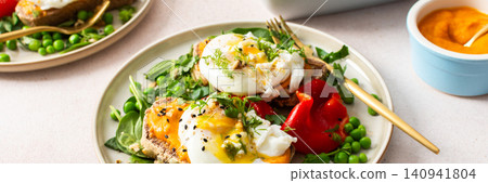 This meal features gluten free bread sandwiches topped with zucchini caviar and poached egg. It includes roasted red peppers and green peas, served with baked pears. banner This meal features gluten free bread sandwiches topped with zucchini caviar and poached egg. It includes roasted red peppers and green peas, served with baked pears. banner 140941804