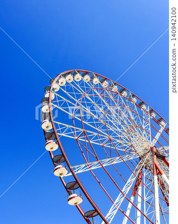 Ferris Wheel Against Blue Sky Ferris Wheel Against Blue Sky 140942100