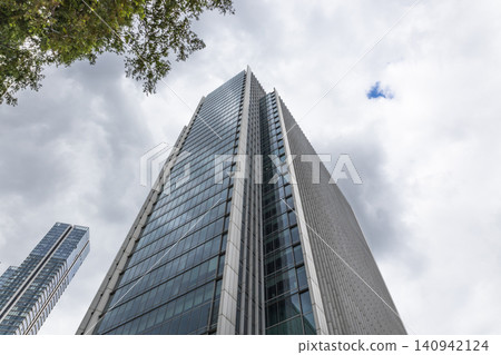 Low angle view of a skyscraper in Canary Wharf, London Low angle view of a skyscraper in Canary Wharf, London 140942124