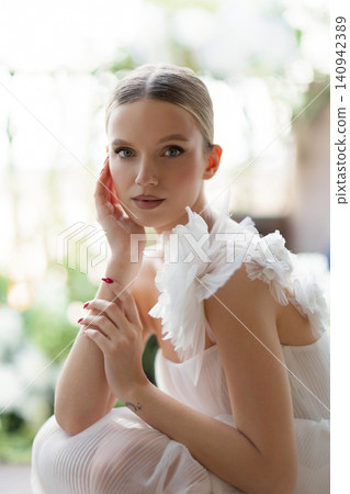 Elegant bride in white dress posing Elegant bride in white dress posing 140942389