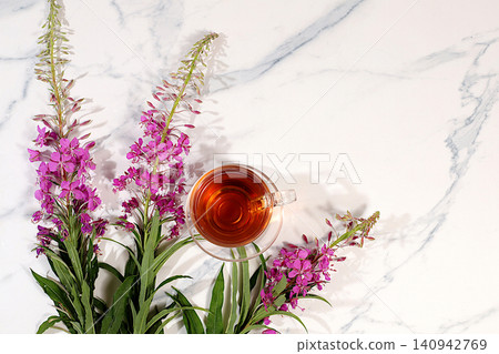 Fireweed infusion in glasses with bouquet of flowers, medicinal herbal tea, alternative folk medicine concept, green pharmacy advertisement,collection of beneficial herbs for folk medicine, Fireweed infusion in glasses with bouquet of flowers, medicinal herbal tea, alternative folk medicine concept, green pharmacy advertisement,collection of beneficial herbs for folk medicine, 140942769