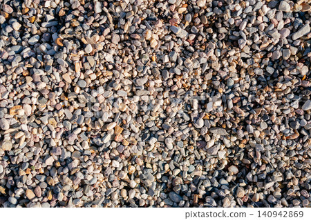 Small pebbles on a sunny day as a screensaver. High quality photo Small pebbles on a sunny day as a screensaver. High quality photo 140942869