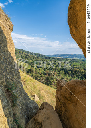 Layers of green mountains and hills in the haze during sunset. Panoramic View of Green hills and Meadow. Layers of green mountains and hills in the haze during sunset. Panoramic View of Green hills and Meadow. 140943309