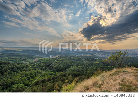 View of the mountains and Kislovodsk from the observation decks of the Kislovodsk Park. Evening sunset over the mountains of Kislovodsk. View of the mountains and Kislovodsk from the observation decks of the Kislovodsk Park. Evening sunset over the mountains of Kislovodsk. 140943338