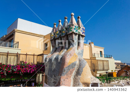 Chimney of the Casa Batllo in Barcelona, Spain. The building designed by Antoni Gaudi Chimney of the Casa Batllo in Barcelona, Spain. The building designed by Antoni Gaudi 140943362