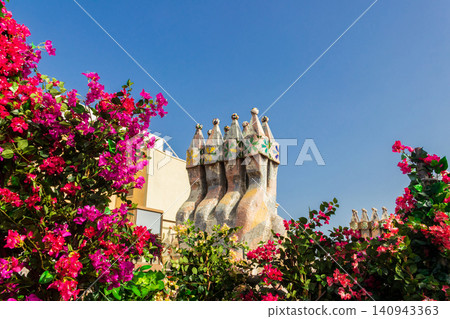Chimney of the Casa Batllo in Barcelona, Spain. The building designed by Antoni Gaudi Chimney of the Casa Batllo in Barcelona, Spain. The building designed by Antoni Gaudi 140943363