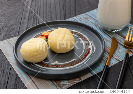 Gourmet mini steamed sponge cakes served with milk, modern healthy fitness diet snack Gourmet mini steamed sponge cakes served with milk, modern healthy fitness diet snack 140944164