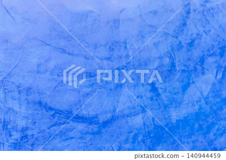 Blue painted plaster wall texture layered brush patterns subtle tonal variation artistic finish ideal for backgrounds decorative design creative projects Blue painted plaster wall texture layered brush patterns subtle tonal variation artistic finish ideal for backgrounds decorative design creative projects 140944459