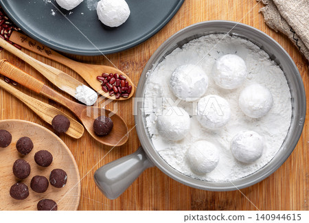 raw sweet rice balls with red bean fillings, unbaked Chinese Tangyuan mochi before cooking raw sweet rice balls with red bean fillings, unbaked Chinese Tangyuan mochi before cooking 140944615