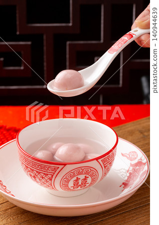 pink strawberry flavored sweet rice balls, cooked colorful Chinese Tangyuan mochi dessert 140944639