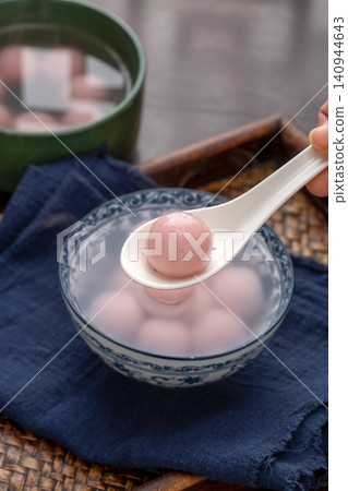 pink strawberry flavored sweet rice balls, cooked colorful Chinese Tangyuan mochi dessert pink strawberry flavored sweet rice balls, cooked colorful Chinese Tangyuan mochi dessert 140944643