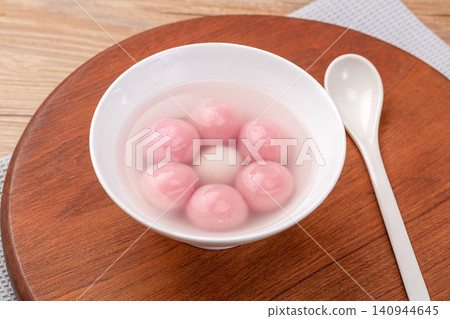 pink strawberry flavored sweet rice balls, cooked colorful Chinese Tangyuan mochi dessert pink strawberry flavored sweet rice balls, cooked colorful Chinese Tangyuan mochi dessert 140944645