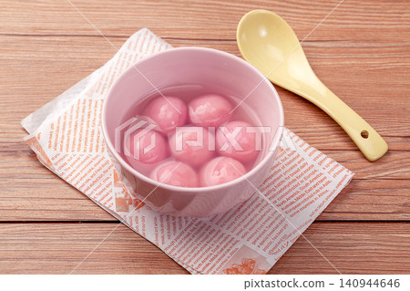 pink strawberry flavored sweet rice balls, cooked colorful Chinese Tangyuan mochi dessert pink strawberry flavored sweet rice balls, cooked colorful Chinese Tangyuan mochi dessert 140944646