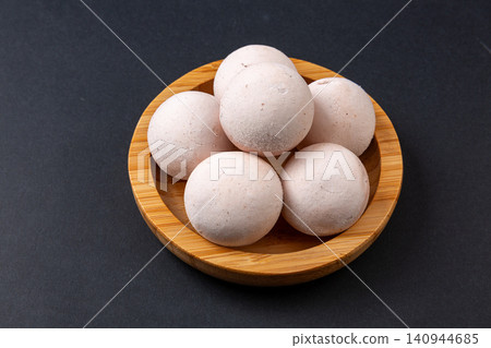 raw red sorghum glutinous rice balls, uncooked whole grain Tangyuan with black sesame filling raw red sorghum glutinous rice balls, uncooked whole grain Tangyuan with black sesame filling 140944685