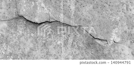 The texture of a weathered concrete wall with large cracks. The texture of a weathered concrete wall with large cracks. 140944791