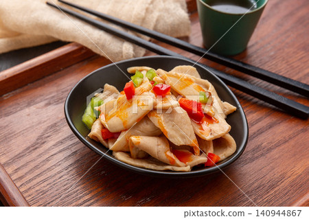 spicy Chinese cold salad with vegetarian chicken wings, savory seasoned soy protein slices with chili oil 140944867