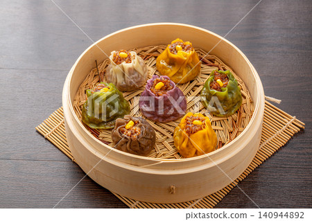 assorted multi flavor Chinese shumai dumplings, colorful steamed Siu Mai with mixed fillings, traditional asian dim sum assorted multi flavor Chinese shumai dumplings, colorful steamed Siu Mai with mixed fillings, traditional asian dim sum 140944892