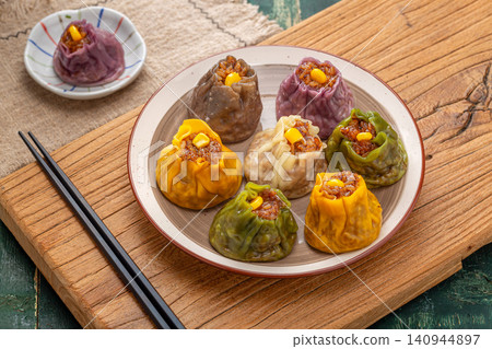 assorted multi flavor Chinese shumai dumplings, colorful steamed Siu Mai with mixed fillings, traditional asian dim sum assorted multi flavor Chinese shumai dumplings, colorful steamed Siu Mai with mixed fillings, traditional asian dim sum 140944897