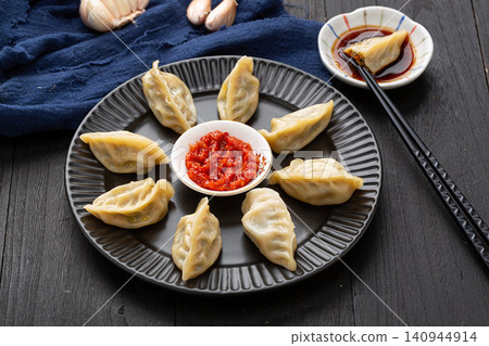 chinese traditional steamed dumplings, cooked Shaxian snacks Jiaozi with savory pork filling, authentic asian dim sum chinese traditional steamed dumplings, cooked Shaxian snacks Jiaozi with savory pork filling, authentic asian dim sum 140944914
