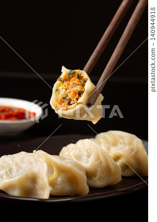 chinese traditional steamed dumplings, cooked Shaxian snacks Jiaozi with savory pork filling, authentic asian dim sum chinese traditional steamed dumplings, cooked Shaxian snacks Jiaozi with savory pork filling, authentic asian dim sum 140944918
