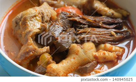 rice vermicelli with northern thai curry sauce on blue background 140945025