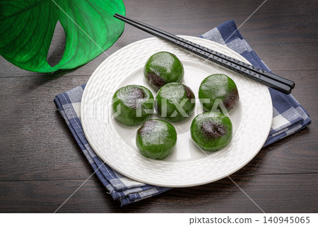 traditional Chinese sweet green rice balls, Qingtuan sticky mochi for Qingming festival, asian spring dessert traditional Chinese sweet green rice balls, Qingtuan sticky mochi for Qingming festival, asian spring dessert 140945065