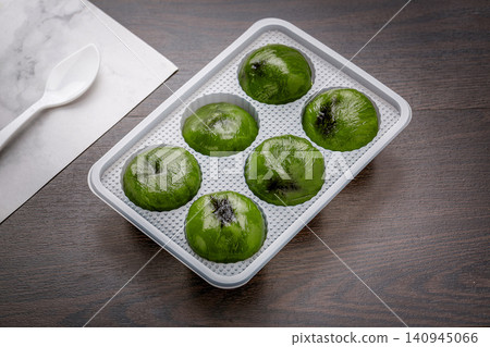 traditional Chinese sweet green rice balls, Qingtuan sticky mochi for Qingming festival, asian spring dessert traditional Chinese sweet green rice balls, Qingtuan sticky mochi for Qingming festival, asian spring dessert 140945066
